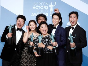 The cast of "Parasite" poses backstage with their Outstanding Performance by a Cast in a Motion Picture award at the 26th Screen Actors Guild Awards in Los Angeles on Jan. 19, 2020.