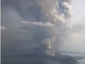 A view of the Taal volcano eruption seen from Tagaytay, Philippines January 12, 2020 in this still image taken from social media video.