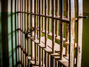 This photo illustration shows a prison cell.