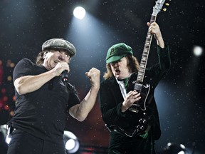 Brian Johnson, left, and Angus Young, right, of AC/DC perform at Commonwealth Stadium in Edmonton, Alta. on Sept. 20, 2015. Codie McLachlan/Postmedia Network