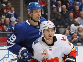 Calgary's Derek Ryan  battles Leafs' Jason Spezza Thursday night. (Getty images)