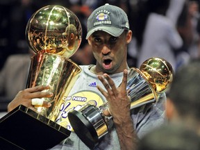 Kobe Bryant of the Los Angeles Lakers celebrates victory following Game 5 of the NBA Finals against the Orlando Magic at Amway Arena on June 14, 2009 in Orlando, Fla.
