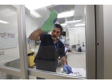 Rick Mazda, environmental attendant scrubs down negative pressure clean room at Humber River Hospital. They are ready if the Coronavirus spreads.  Thursday January 7, 2021. Stan Behal/Toronto Sun/Postmedia Network