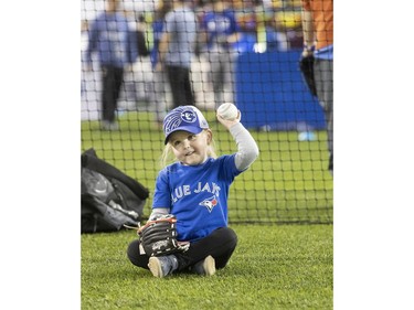 3 year old Maggie Chard, from Brantford tries out her baseball skills, as the Toronto Blue Jays' introduced their new look uniform today at Winter Fest.  Blue Jay  fans enjoyed the carnival atmosphere in a re-imagined Rogers Centre  in Toronto, Ont. on Saturday January 18, 2020. Stan Behal/Toronto Sun/Postmedia Network