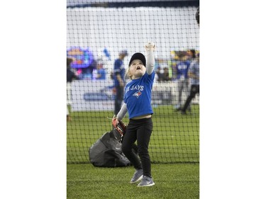 3 year old Maggie Chard, from Brantford tries out her baseball skills, as the Toronto Blue Jays' introduced their new look uniform today at Winter Fest.  Blue Jay  fans enjoyed the carnival atmosphere in a re-imagined Rogers Centre  in Toronto, Ont. on Saturday January 18, 2020. Stan Behal/Toronto Sun/Postmedia Network