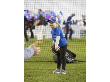 3 year old Maggie Chard, from Brantford tries out her baseball skills, as the Toronto Blue Jays' introduced their new look uniform today at Winter Fest.  Blue Jay  fans enjoyed the carnival atmosphere in a re-imagined Rogers Centre  in Toronto, Ont. on Saturday January 18, 2020. Stan Behal/Toronto Sun/Postmedia Network