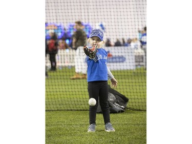 3 year old Maggie Chard, from Brantford tries out her baseball skills, as the Toronto Blue Jays' introduced their new look uniform today at Winter Fest.  Blue Jay  fans enjoyed the carnival atmosphere in a re-imagined Rogers Centre  in Toronto, Ont. on Saturday January 18, 2020. Stan Behal/Toronto Sun/Postmedia Network