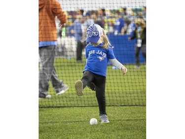 3 year old Maggie Chard, from Brantford tries out her baseball skills, as the Toronto Blue Jays' introduced their new look uniform today at Winter Fest.  Blue Jay  fans enjoyed the carnival atmosphere in a re-imagined Rogers Centre  in Toronto, Ont. on Saturday January 18, 2020. Stan Behal/Toronto Sun/Postmedia Network