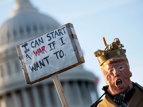A demonstrator dressed as President Donald Trump stands in front of the U.S. Capitol in Washington on January 9, 2020 during a rally on "No War with Iran." (JIM WATSON/AFP via Getty Images)