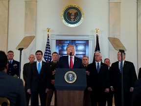U.S. President Donald Trump delivers a statement about Iran flanked by U.S. Defense Secretary Mark Esper, Army Chief of Staff General James McConville, Chiarman of the Joint Chiefs of Staff Army General Mark Milley, Vice President Mike Pence and Secretary of State Mike Pompeo in the Grand Foyer at the White House in Washington, U.S., January 8, 2020. REUTERS/Kevin Lamarque