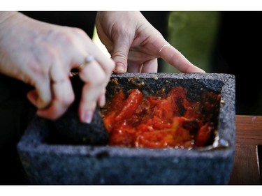 Roasted tomatoes and other grilled vegetables are mashed together with a mortar and pestle at the Grand Fiesta Americana Los Cabos All Inclusive Golf & Spa in Cabo San Lucas, Mexico on Wednesday November 20, 2019. Veronica Henri/Toronto Sun/Postmedia Network