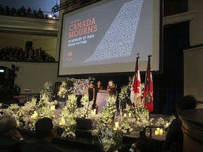 Banafsheh Taherian (L) and Kyan Nademi (R) were the co-emcees handled the honours as hundreds of people, dignitaries and politicians  packed the University of Toronto's Convocation Hall for an event called Canada Mourns - In Memory of Iran Crash Victims on Sunday January 12, 2020. Jack Boland/Toronto Sun/Postmedia Network