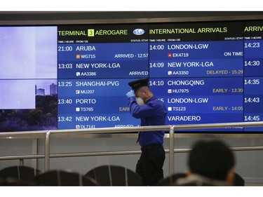 Flights arrive from three Chinese destinations at Pearson International Airport's Terminal 3 from Beijing, Shanghai and Chongqing. Over a 1,000 passengers arrived, the majority wearing masks as the Coronoavirus that has originated in Wuhan on Monday January 27, 2020. Jack Boland/Toronto Sun/Postmedia Network