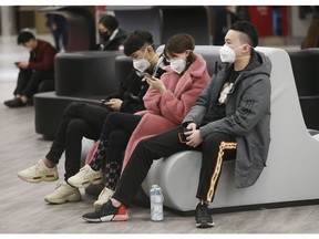 Flights arrive from three Chinese destinations at Pearson International Airport's Terminal 3 from Beijing, Shanghai and Chongqing. Over a 1,000 passengers arrived, the majority wearing masks as the Coronoavirus that has originated in Wuhan on Monday, Jan. 27, 2020. (Jack Boland/Toronto Sun/Postmedia Network)