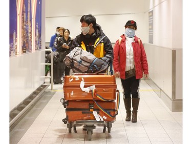 Flights arrive from three Chinese destinations at Pearson International Airport's Terminal 3 from Beijing, Shanghai and Chongqing. Over a 1,000 passengers arrived, the majority wearing masks as protection from the Coronoavirus that has originated in Wuhan on Monday January 27, 2020. Jack Boland/Toronto Sun/Postmedia Network