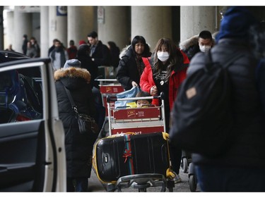 Flights arrive from three Chinese destinations at Pearson International Airport's Terminal 3 from Beijing, Shanghai and Chongqing. Over a 1,000 passengers arrived, the majority wearing masks as protection from the Coronoavirus that has originated in Wuhan on Monday January 27, 2020. Jack Boland/Toronto Sun/Postmedia Network