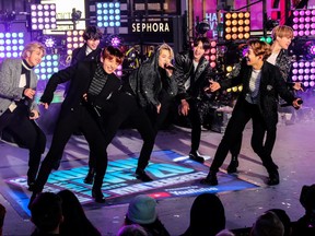 BTS performs during New Year's Eve celebrations in Times Square in the Manhattan borough of New York, U.S., December 31, 2019.  REUTERS/Jeenah Moon