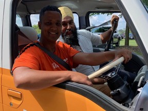 Hamilton Centre MP Matthew Green gives federal NDP leader Jagmeet Singh a ride in his distinctive Subaru 'Kei' van in Hamilton, Ont. on Sept. 9 2019.