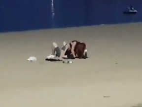 A couple are seen making out on a beach in Pattaya, Thailand, before having sex on Dec. 31, 2019.