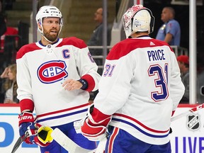 Montreal Canadiens defenceman Shea Weber and goaltender Carey Price talk against the Carolina Hurricanes at PNC Arena in Oct. 3, 2019 in Raleigh, N.C.