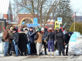 Members of the Ontario English Catholic Teachers Association picket outside St. Mary's High School on Tuesday in Owen Sound.