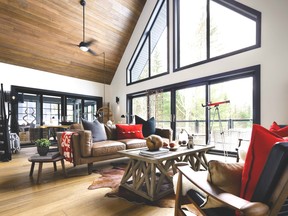 A cottage space, designed by Colin and Justin, where our signature palette (wood, white drywall, red accents and black fenestration) serves as the ideal backdrop for tan hide upholstery.
