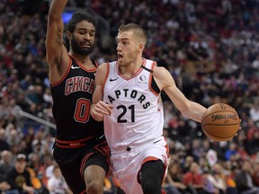 Toronto Raptors guard Matt Thomas  dribbles the ball past Chicago Bulls guard Coby White during their game last week. USA TODAY SPORTS