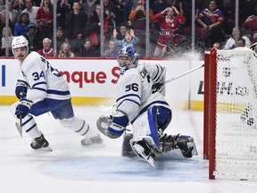 Goaltender Jack Campbell #36 of the Toronto Maple Leafs allows an overtime goal as teammate Auston Matthews #34 looks on against the Montreal Canadiens at the Bell Centre on February 8, 2020 in Montreal. (Minas Panagiotakis/Getty Images)