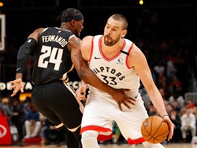 Marc Gasol of the Raptors draws a foul from Bruno Fernando. Kevin C. Cox/Getty Images)