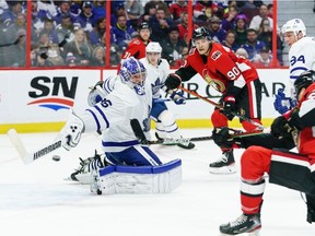 Connor Brown of the Ottawa Senators gets the puck past Jack Campbell of the Toronto Maple Leafs as Vladislav Namestnikov of the Ottawa Senators and Tyson Barrie of the Toronto Maple Leafs look on in the second period at Canadian Tire Centre on February 15, 2020 in Ottawa, Ontario, Canada.