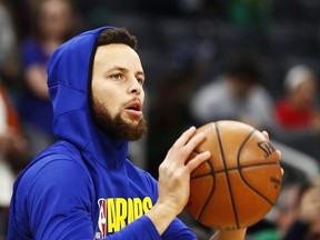 Stephen Curry of the Golden State Warriors warms up before the game against the Boston Celtics at TD Garden on January 30, 2020 in Boston, Massachusetts.
