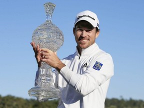 Nick Taylor of Canada poses with the trophy after winning the AT&T Pebble Beach Pro-Am at Pebble Beach Golf Links on Feb. 9, 2020 in Pebble Beach, Calif. (CHRIS TROTMAN/Getty Images files)
