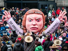 A float with an effigy depicting Greta Thunberg makes its way past revellers during the Rose Monday carnival parade on Feb. 24, 2020 in Dusseldorf, Germany. (Lukas Schulze/Getty Images)