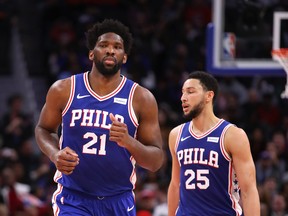 Joel Embiid (left) and Ben Simmons have not fit well together for the Philadelphia 76ers. (GETTY IMAGES)
