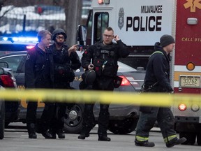 Police and emergency officials work at an active shooter scene at the Molson Coors headquarters in Milwaukee, Wis., Feb. 26, 2020.