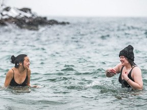 A couple of swimmers brave the chilly water at Humber Bay Park on Feb. 2, 2020. (Ernest Doroszuk, Toronto Sun)