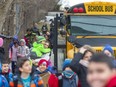 In this photo, students walk home or line up for school buses at Eagle Heights public school in London, Ont. (Postmedia Network)
