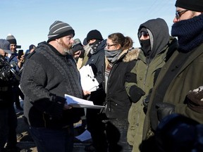 The Canadian National Police Service (CN Police) serve an injunction to pipeline protesters at a railway blockade in Edmonton.
(Reuters)