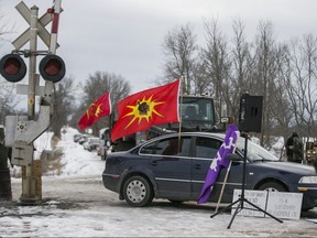 Mohawk Warrior flags were on display at an anti-pipeline protest  at Wyman Rd., east of Belleville, on Feb. 11, 2020. (Ernest Doroszuk, Toronto Sun)