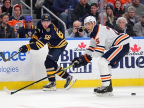 Edmonton Oilers' Darnell Nurse tries to block a pass by Buffalo Sabres' Victor Olofsson last month. (GETTY IMAGES)
