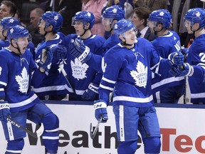 Justin Holl (right) and Travis Dermott (23), along with three other members of the 2017-18 Calder Cup-champion Toronto Marlies blue-line, have suddenly been entrusted with holding the fort on the Maple Leafs’ back end with Jake Muzzin joining Morgan Rielly and Cody Ceci on the injured list.  Frank Gunn/CP