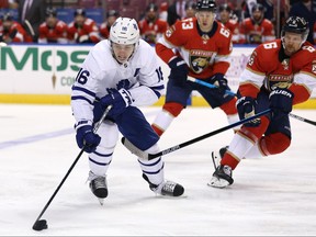 Toronto Maple Leafs right wing Mitch Marner, left, skates with the puck during the first period of the game against the Florida Panthers at BB&T Center in Sunrise,Fla., Feb. 27, 2020. (Sam Navarro-USA TODAY Sports)