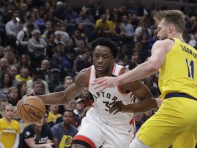 Raptors' OG Anunoby (3) goes to the basket against Indiana Pacers' Domantas Sabonis (11) during the first half on Friday night. (AP Photo/Darron Cummings)
