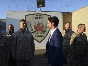 Prime Minister Justin Trudeau visits with Canadian troops at Camp Canada at Ali al Salem Air Base in Kuwait on Monday, Feb. 10, 2020. THE CANADIAN PRESS/Sean Kilpatrick