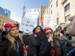 Striking school teachers protest outside a speech by Ontario Education Minister Stephen Lecce in Toronto on Wednesday, February 12, 2020. THE CANADIAN PRESS/Frank Gunn