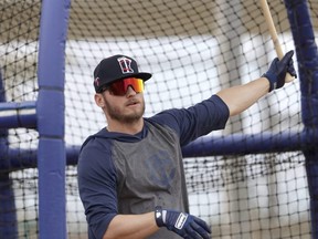 Minnesota Twins infielder Josh Donaldson takes batting practice during spring training baseball camp Sunday, Feb. 16, 2020, in Fort Myers, Fla. (AP Photo/John Bazemore)