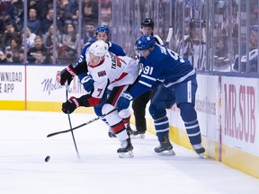 Maple Leafs centre John Tavares (right) battles for a puck with Senators left winger Brady Tkachuk during the second period 
at the Scotiabank Arena last night.  Nick Turchiaro/USA TODAY Sports