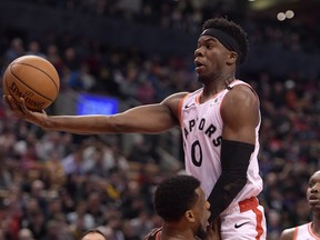 Toronto Raptors guard Terence Davis II (0) drives to the basket over Chicago Bulls forward Thaddeus Young. Davis scored a career high 31 points in the Raptors win. Dan Hamilton-USA TODAY Sports