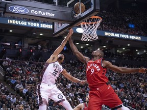 Brooklyn Nets guard Spencer Dinwiddie (26) drives to the basket over Toronto Raptors centre Serge Ibaka (9) during the fourth quarter at Scotiabank Arena. Nick Turchiaro-USA TODAY Sports