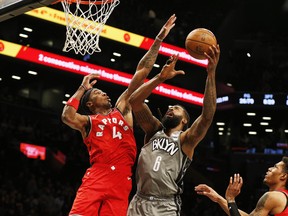 Brooklyn Nets centre DeAndre Jordan (6) shoots against Toronto Raptors forward Rondae Hollis-Jefferson (4) during the second half at Barclays Center. The Raptors don't play again until Friday, Feb. 21.  Andy Marlin-USA TODAY Sports USATSI-407526